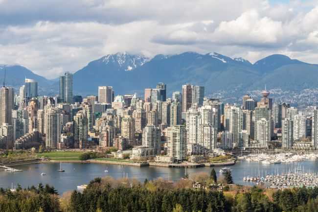 Stunning view of Vancouver's skyline with mountains and marina in the background