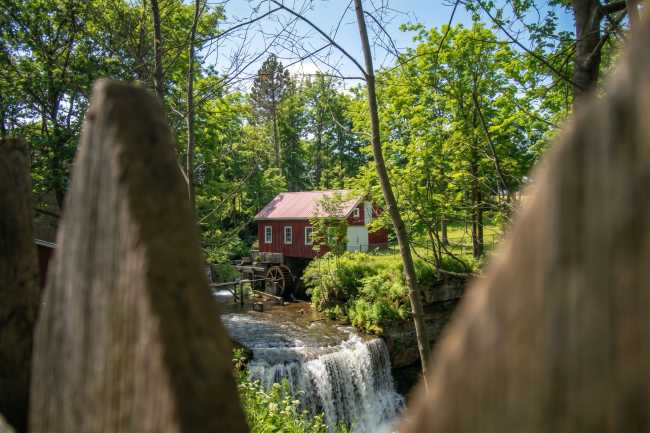 Serene summer landscape featuring a historic watermill in St. Catharines, Ontario, Canada.