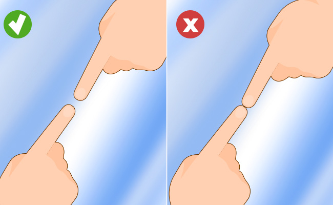 This picture shows how to use just your finger to check if there is a hidden camera in a mirror